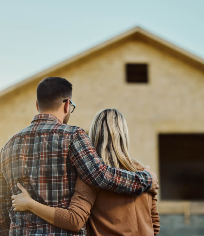Couple looking at developing house