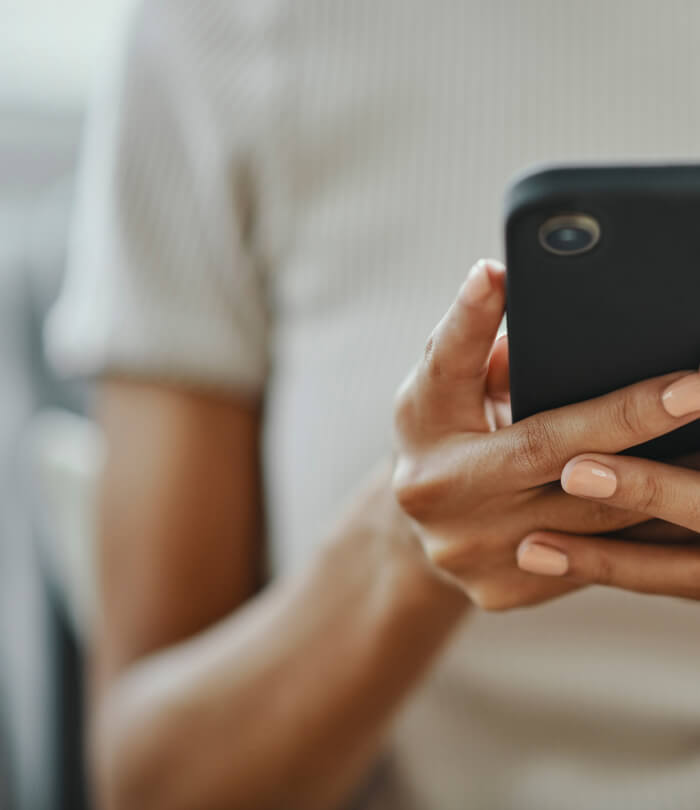 Close-up of person holding mobile phone