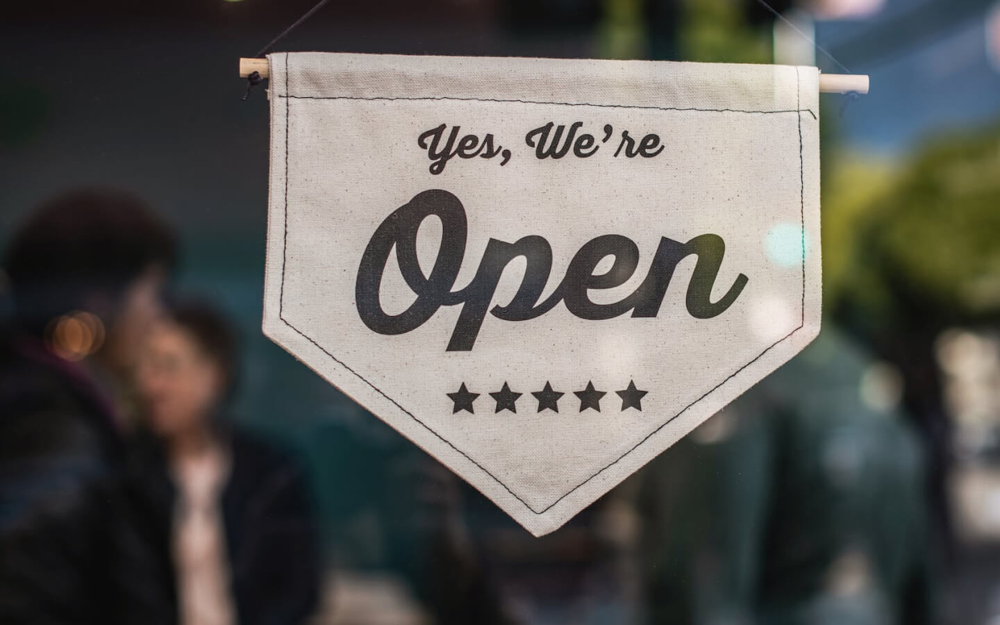 Close-up of open sign on the window