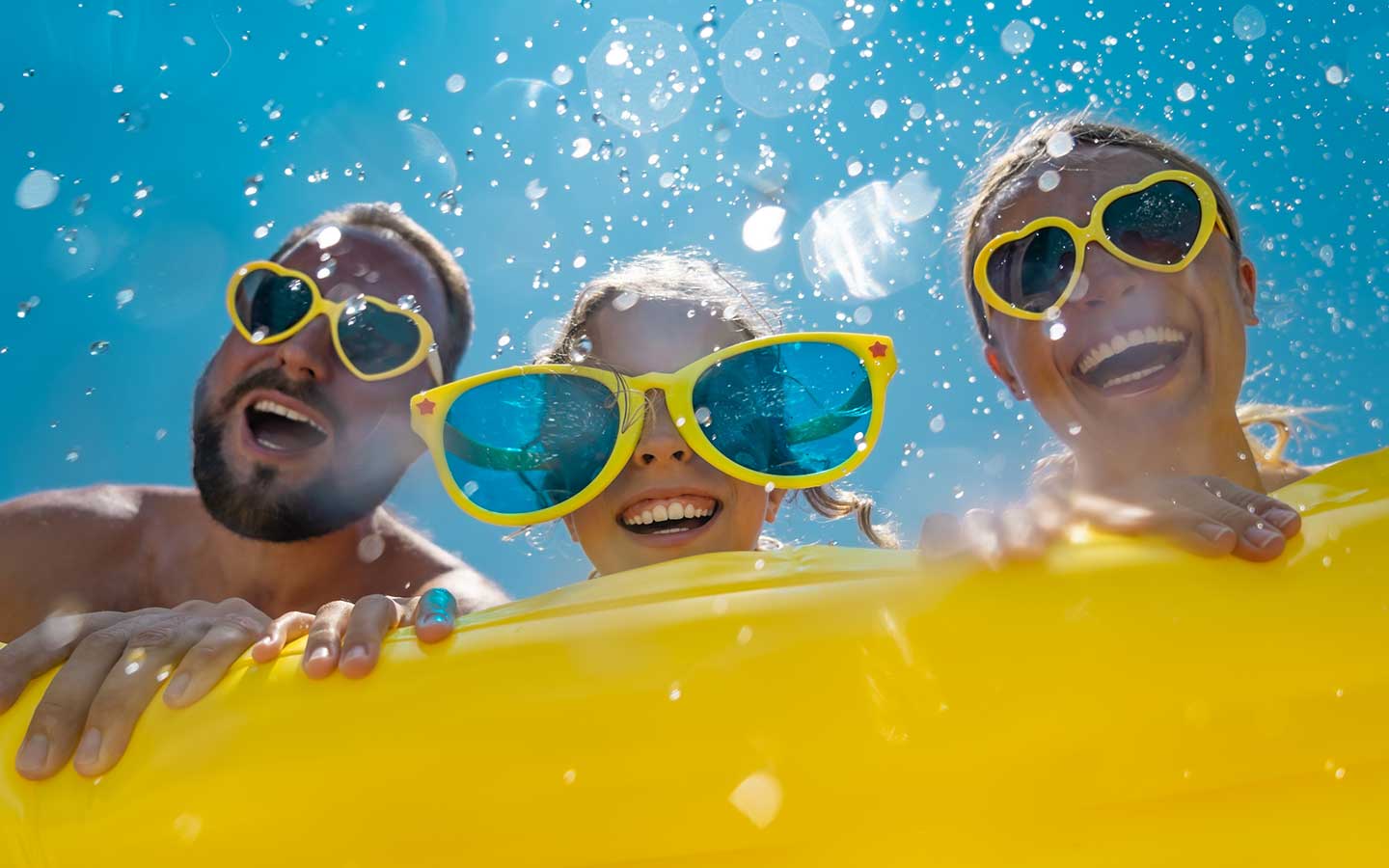 Family smiling in waterpark